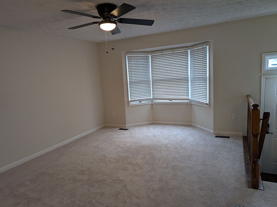Large living room. Freshly carpeted and painted along with the rest of the home. Nice bay window and new ceiling fan.