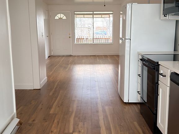 Spacious living area flowing into the kitchen and dining space