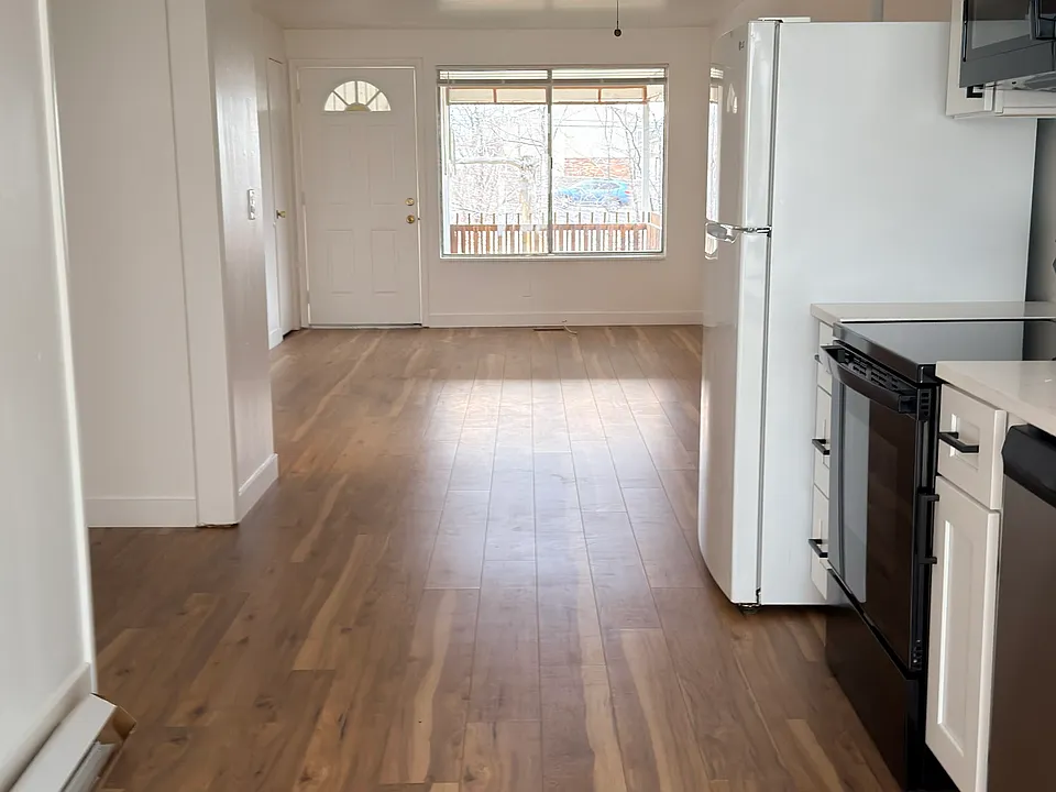 Spacious living area flowing into the kitchen and dining space