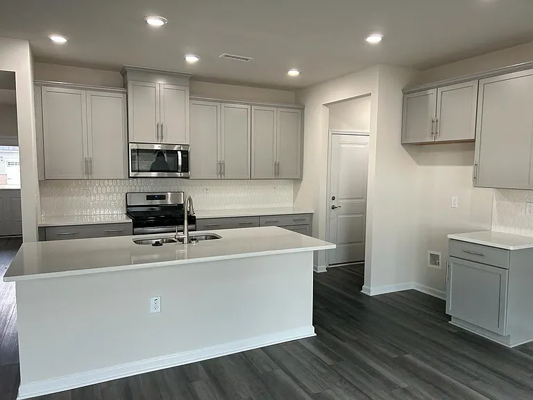 Beautiful Grey Cabinet with Quartz Center Island
