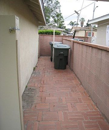 other side of garage, for trash and clothes hanging
