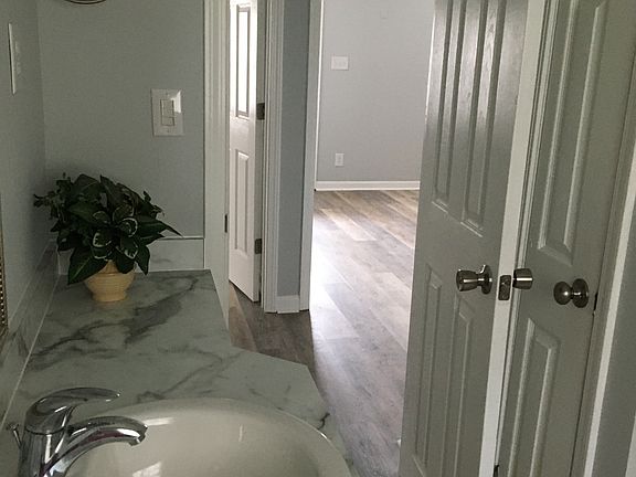 Master bathroom located directly across the hall from the master bedroom