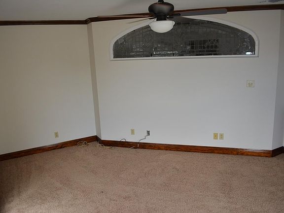 Master bedroom with unique stained glass fixture.