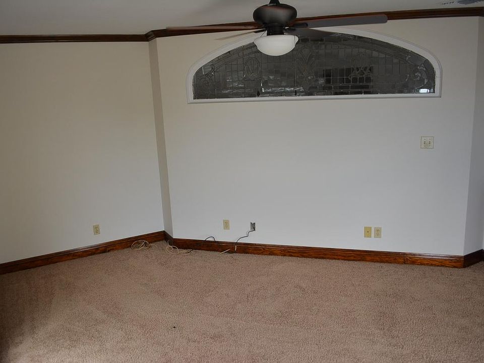 Master bedroom with unique stained glass fixture.