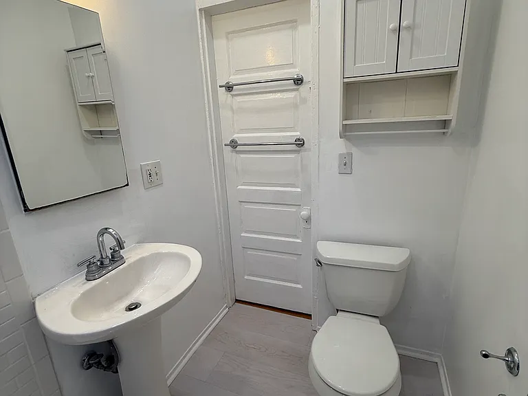 2nd Floor Bathroom (situated in between the 2 back bedrooms) boasts a pedestal sink, shower/tub and new toilet. Again, making this house convenient to share w 2 people, since the back two bedrooms make for a private nook, close to the bathroom