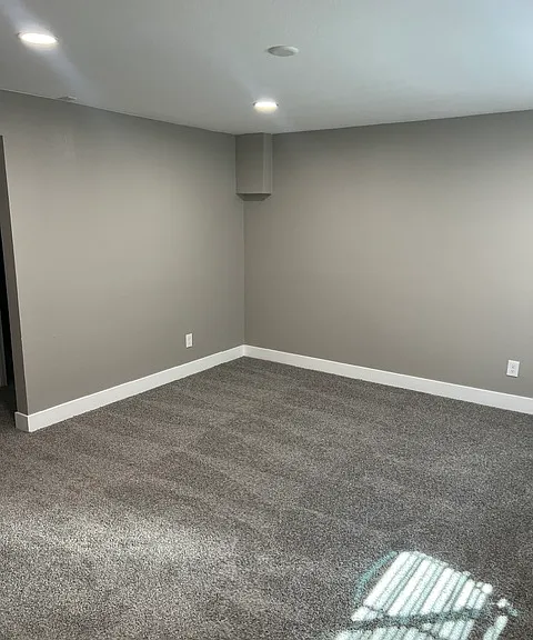 BASEMENT BEDROOM WITH EGGRESS WINDOWS.