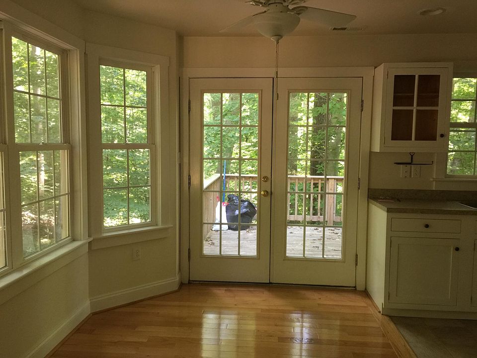 Entry from deck and parking area. Kitchen to the right.