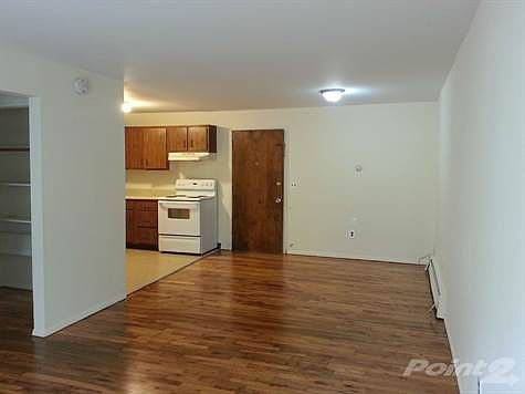 Living Room towards Kitchen and Front Door