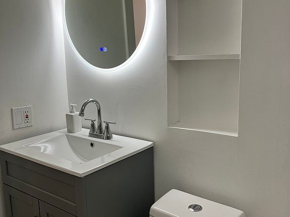 Just installed a new ceramic sink with spacious vanity. Extra storage installed behind the bathroom door. Nice and spacious shower and tub.