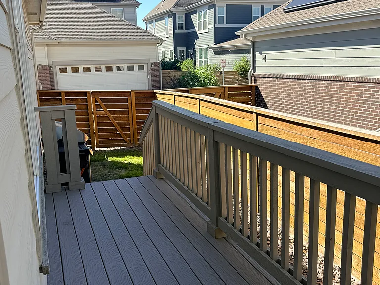 Deck fenced in yard