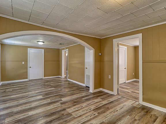 Alt view of living and dining room with kitchen entranace.