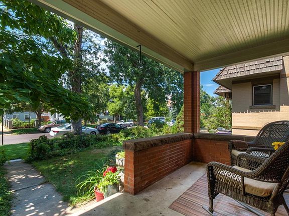 Beautiful shaded front porch for summer evenings.