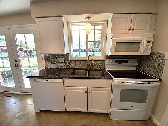 Cheerful kitchen over looking the backyard