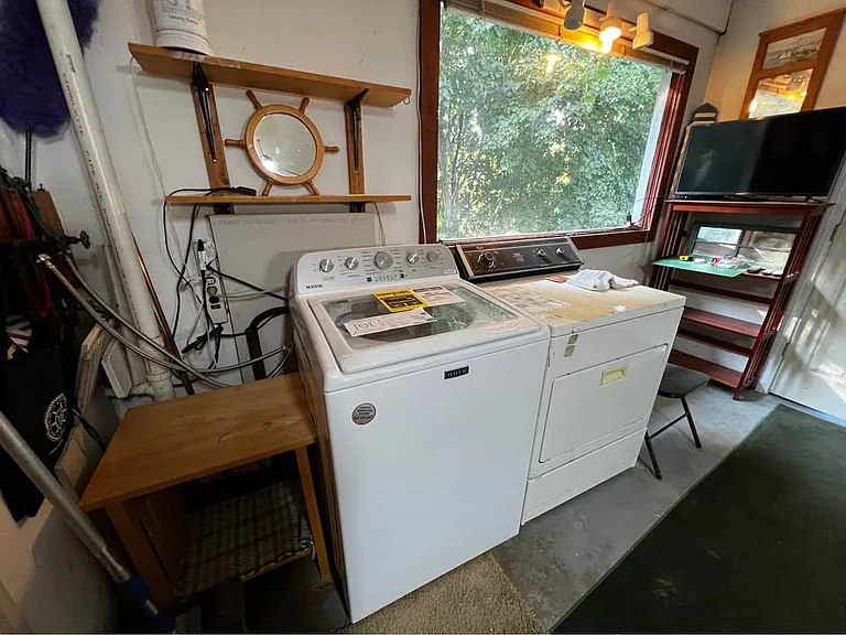 The garage features an included dryer and washer! Along with a big window and garage door to the driveway! With plenty of storage in between!