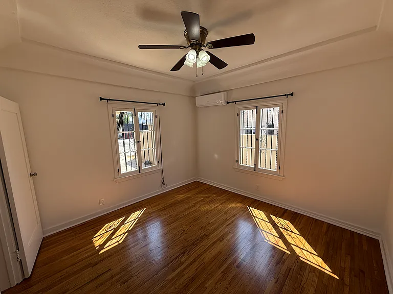 Primary Bedroom with Ceiling Fan Lighting