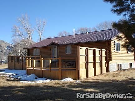 View of Side of Home, Deck, and Fire Pit