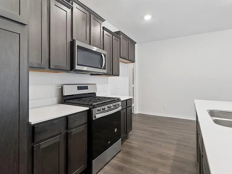 Kitchen does have a refrigerator, gas stove/microwave and dishwasher