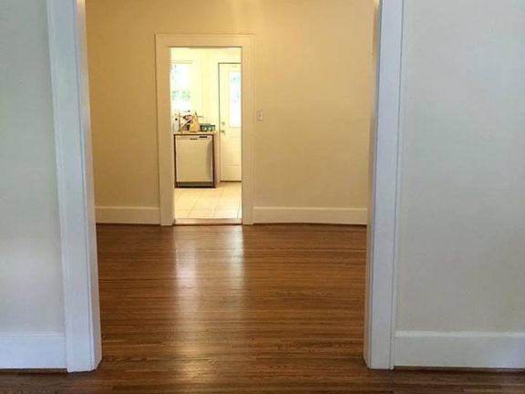 View from the living room through the dining room into the k