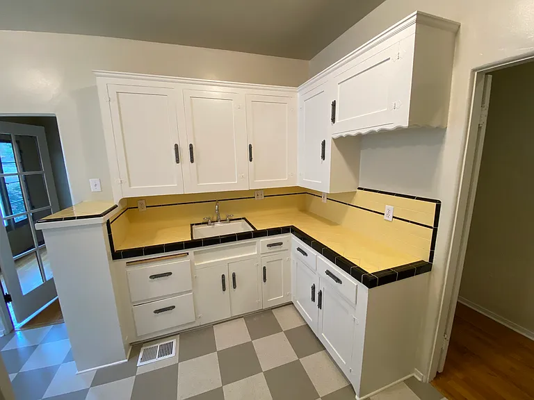 CHARACTER INFUSED KITCHEN WITH MODERN TOUCHES - GARBAGE DISPOSER AND PLENTY OF OUTLETS