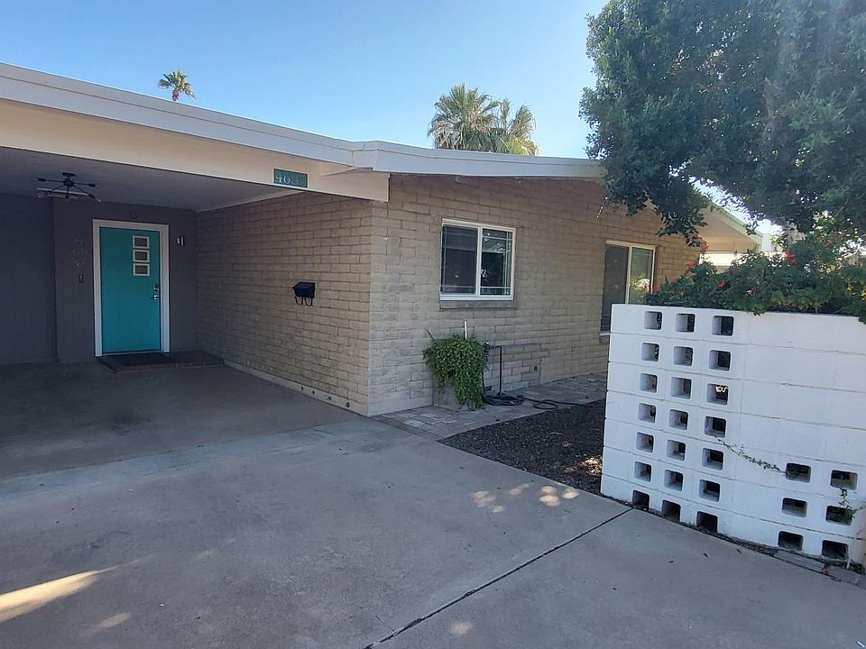 Front of home with carport.