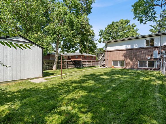 Huge deck with massive fenced in yard (7000 square foot lot for your half) and shed with electricity!