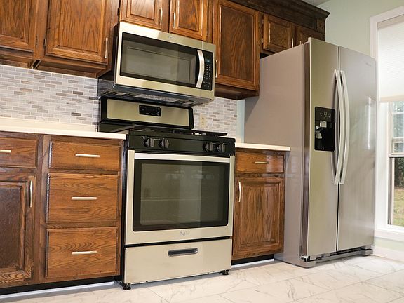 New gas stove and microwave.