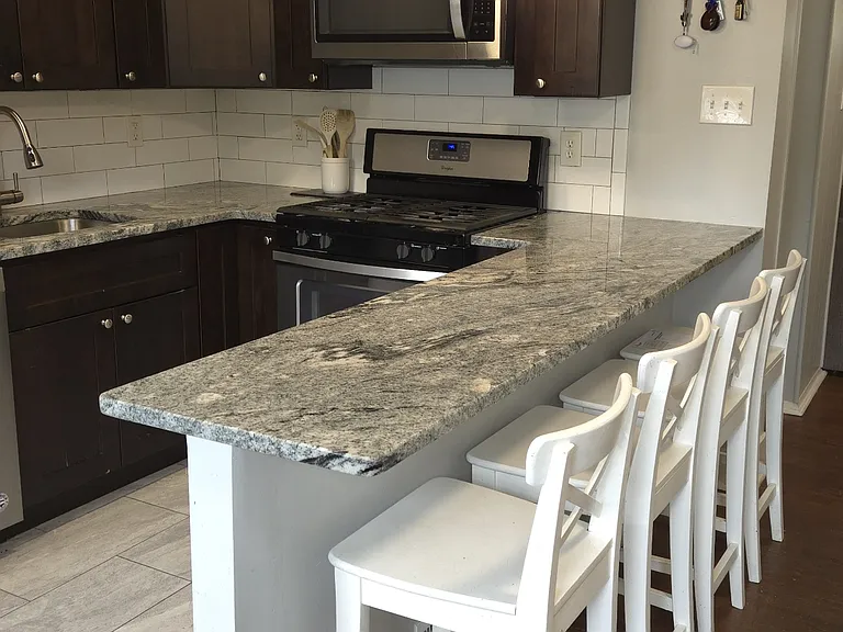 Beautiful Cabinets/Granite/Lighting/ Counters/Breakfast Bar