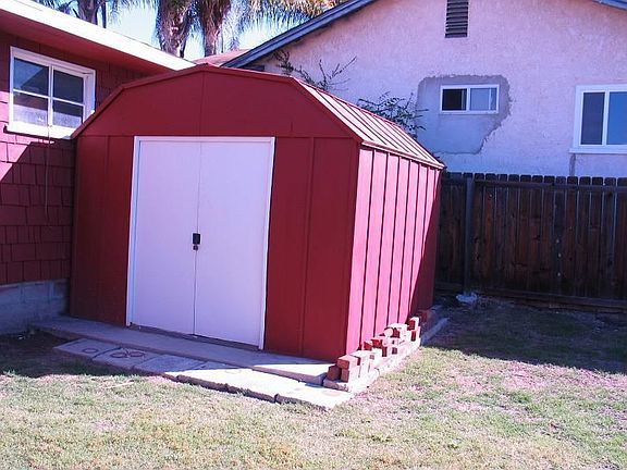 Storage shed behind the garage