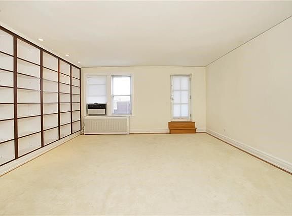 Large Living Room with door to private patio where all four seasons can be enjoyed and appreciated.