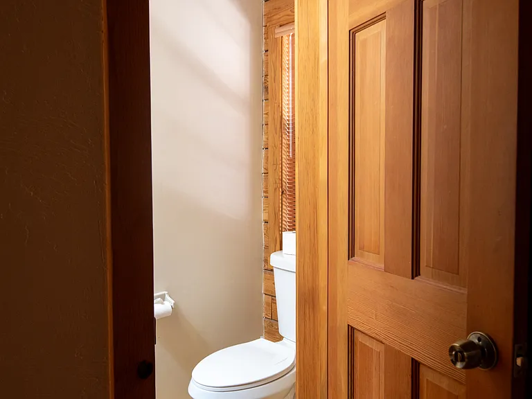 Half bathroom on first floor by laundry room