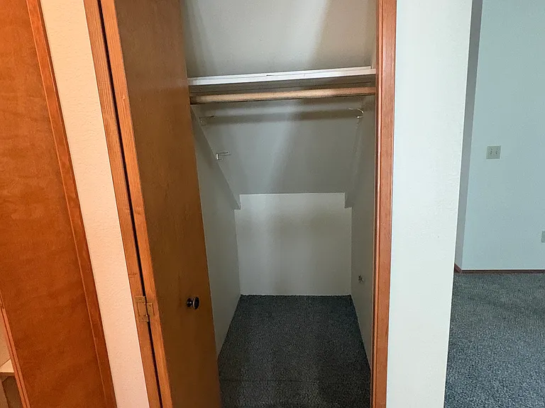 Coat closet in hallway.