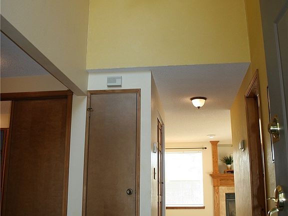 Vaulted ceiling entry with tile floor.