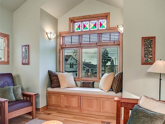 Stained glass window above built in window seat stays!