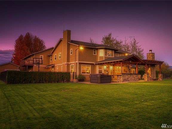 This is a feature packed property inside and out. Notice the heated shop/storage shed to keep your lawn equipment and toys tucked away. 