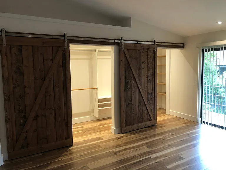 Plenty of shelving and hanging rods in closet.