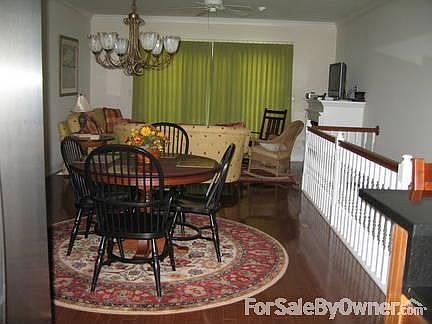 First level : open floor plan, looking into living room, hardwood floors throughout