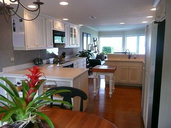 This unit has been tastefully remodeled. Appliances are cabinet faced, storage is abundant, counterspace allows for big entertaining or cooking projects.