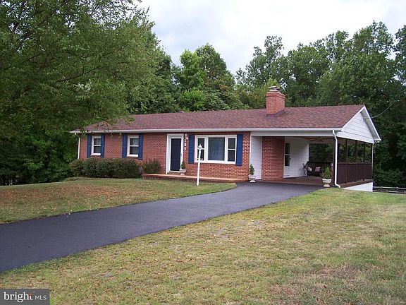 Carport and paved driveway