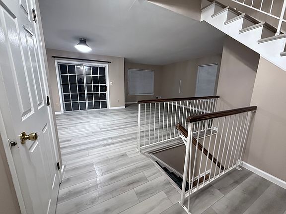 Living Rm, with Sliding door to the balcony and staircase