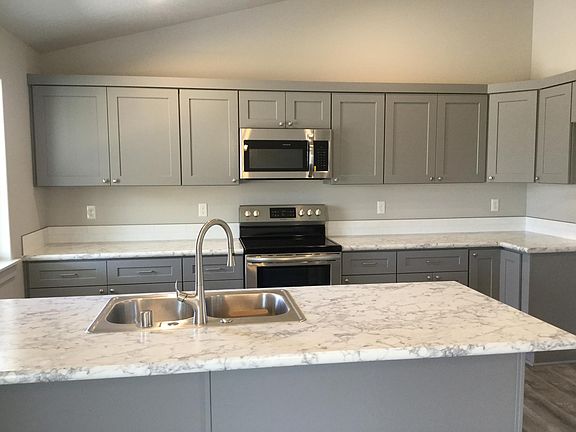 Beautiful Kitchen there is a black refrigerator that is not showing.