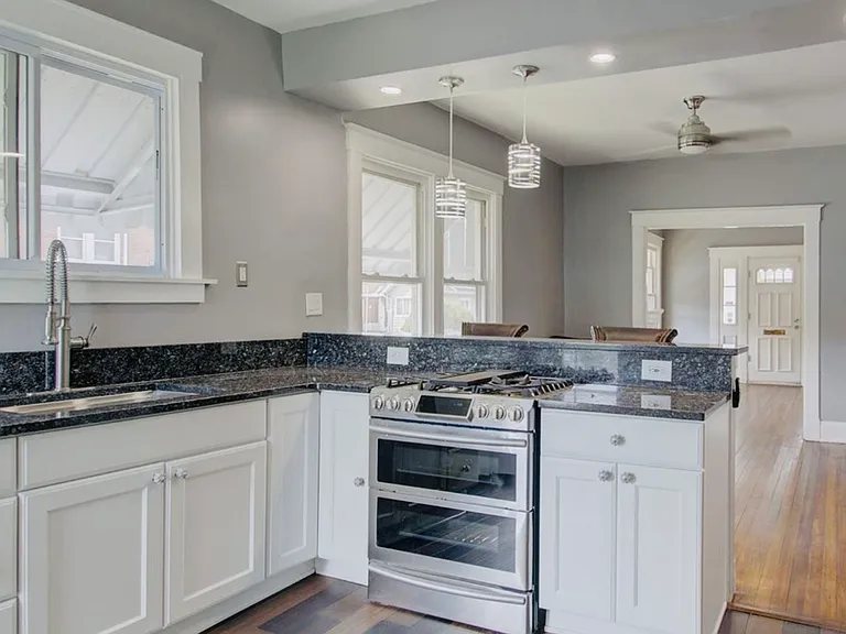 Original Hardwood Floors throughout except for in the kitchen, newly added luxury vinyl plank to the kitchen. To enhance the modern updates that we're done to the entire home.