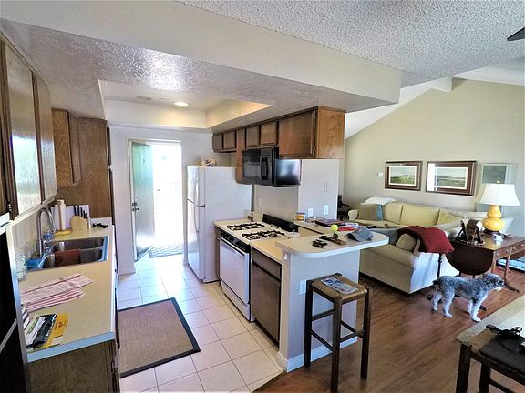 Kitchen and living room viewed from dining room