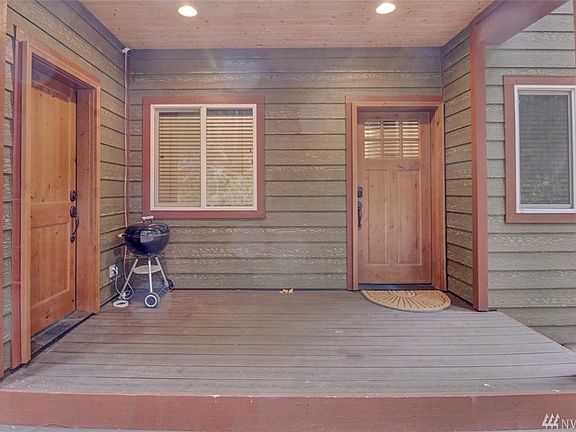 Covered back entry and storage.