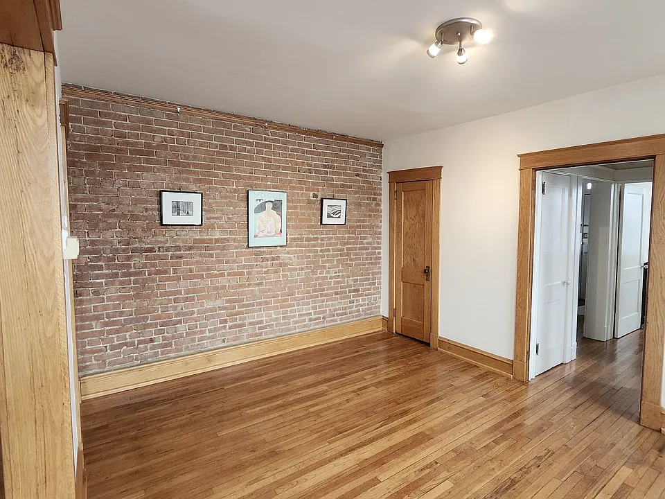 Dining room with exposed brick