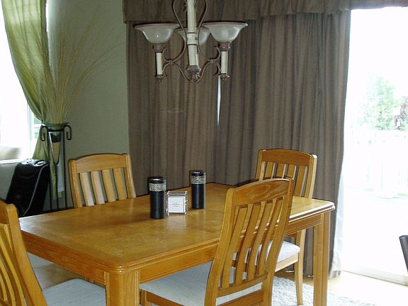adorable kitchen nook with bay windows