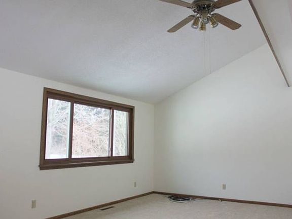 The kitchen eating area flows easily into a comfortable living room...