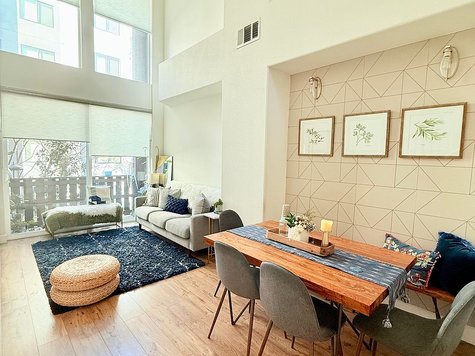 Living and Dining Space. The balcony overlooks the patio.