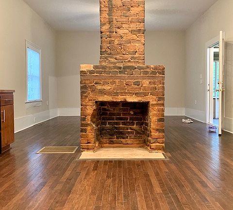 Decorative Fireplace. View from Kitchen to Living/Bedroom.