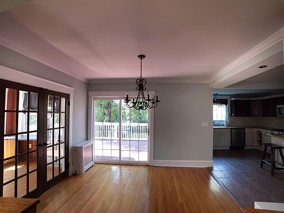 View of dining room to deck ( left is sunroom/ Office) ( right is kitchen)