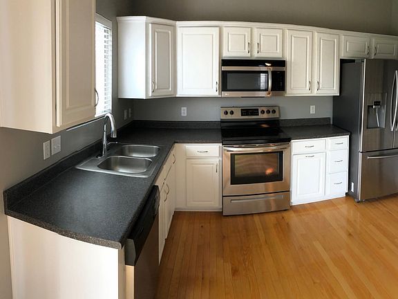 Kitchen with pantry across from fridge